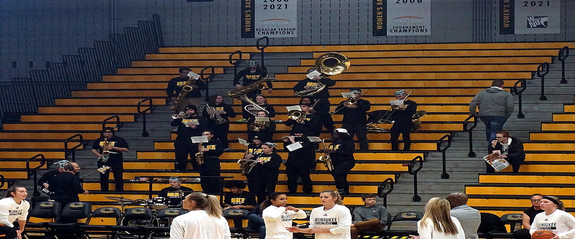 Lancer Pep Band in bleachers rocking basketball gymnasium
